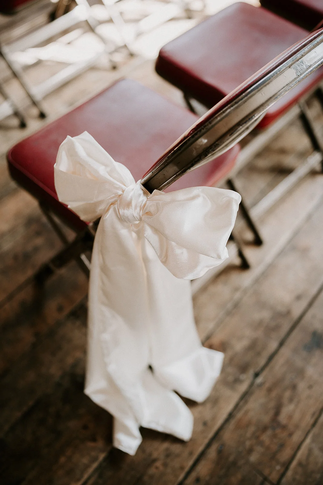 Bows on chairs in the chapel