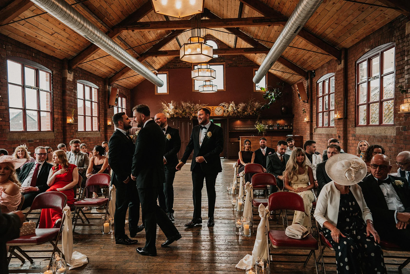 Groomsmen and guests waiting for the bridal party