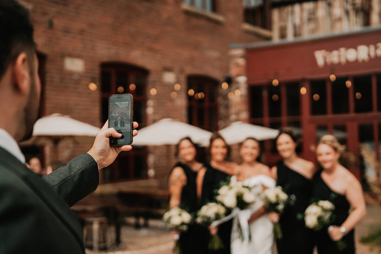 Taking a photo of the groom taking a photo