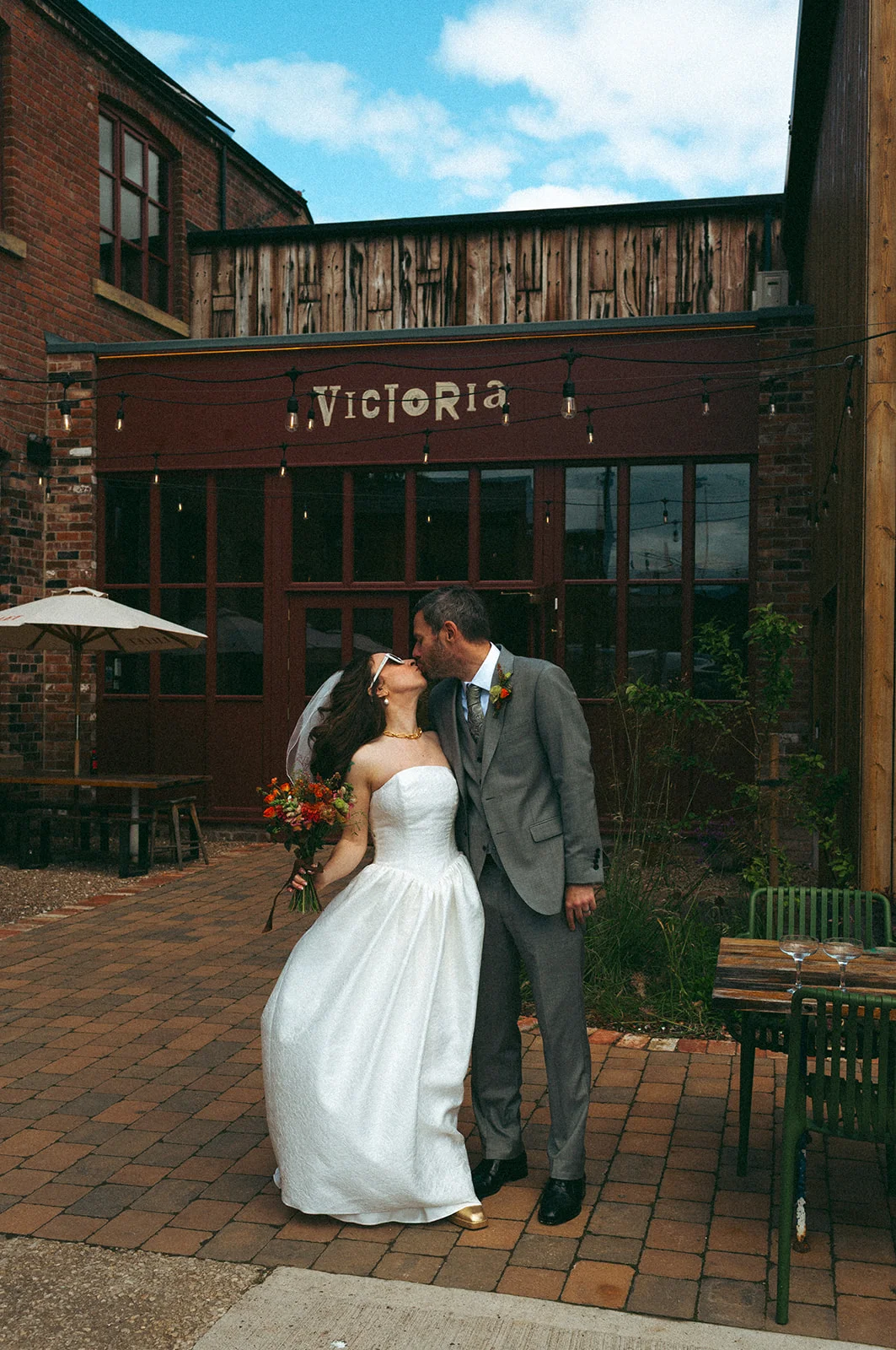 A kiss outside the Victoria